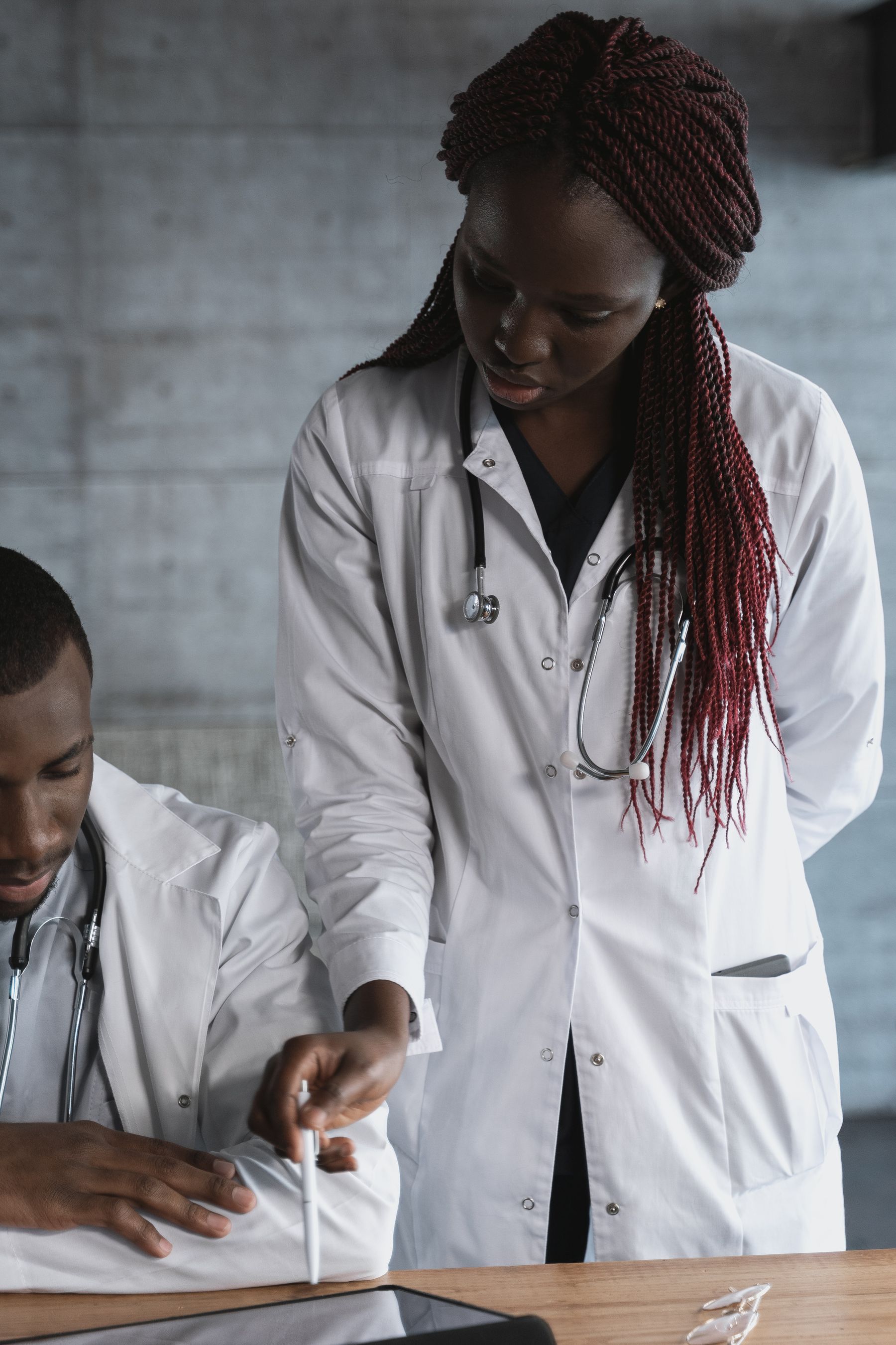 Two clinicians reviewing patient information together